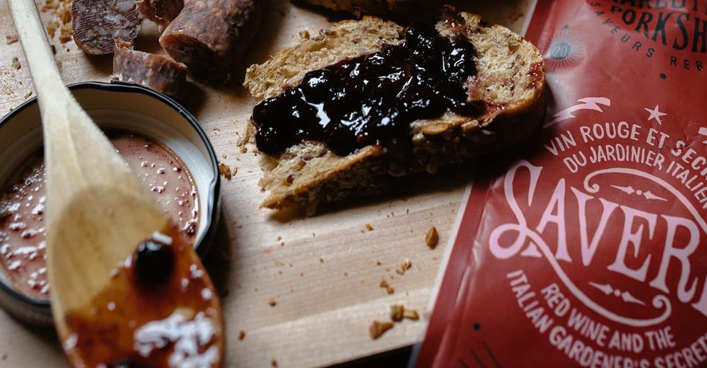 Custom hand-drawn lettering and heritage-style labels for deli products.