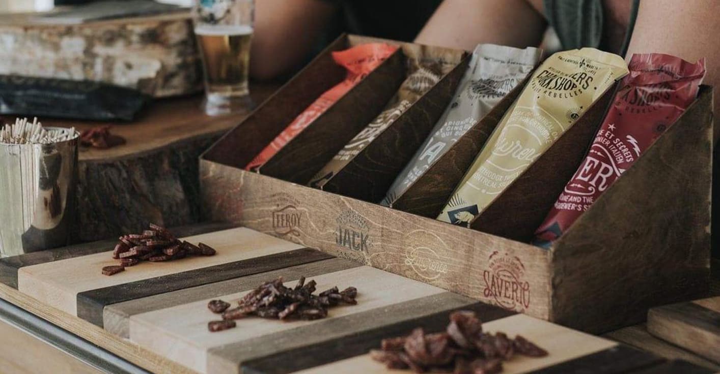 Vintage-inspired graphic storytelling and packaging for local pork products.