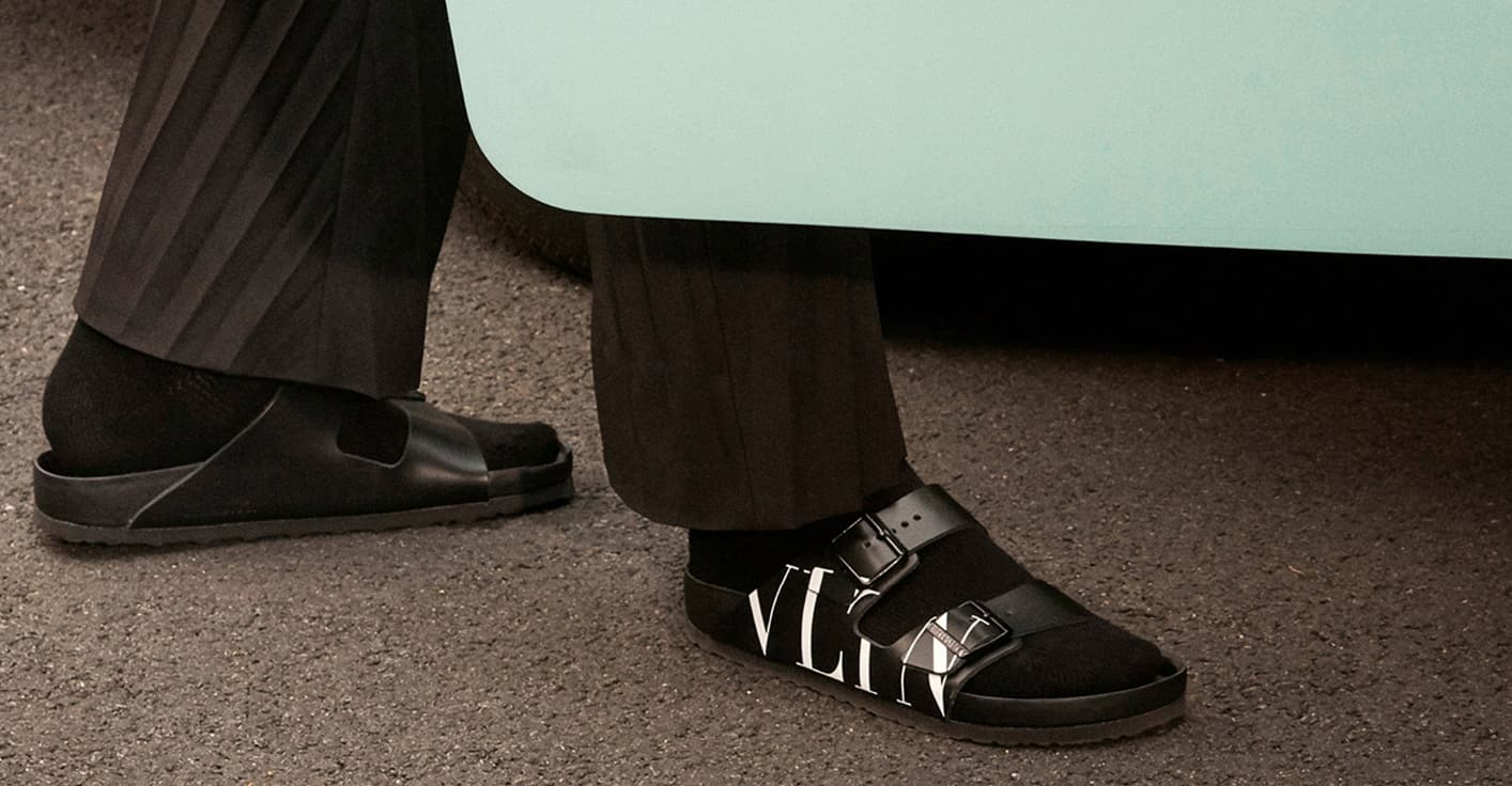 Custom lettering and expert typographic engineering for luxury footwear branding.