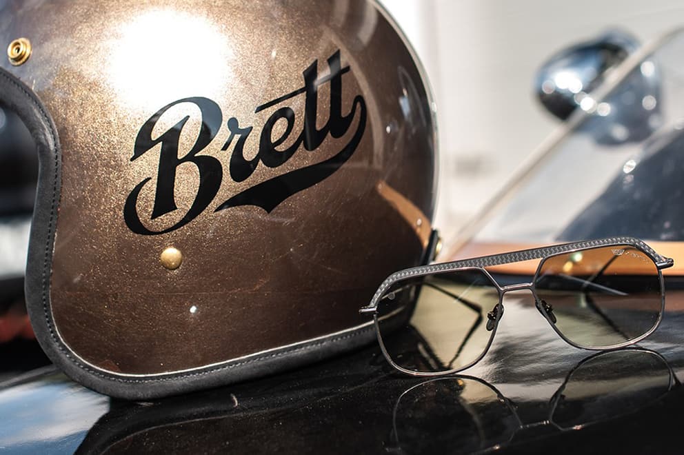 Unique typographic craftsmanship blending motorcycle helmet culture and elegance.