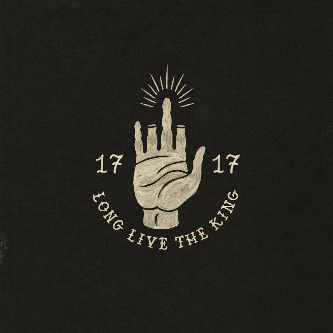 Hand lettering on a dark background, script drawn by hand